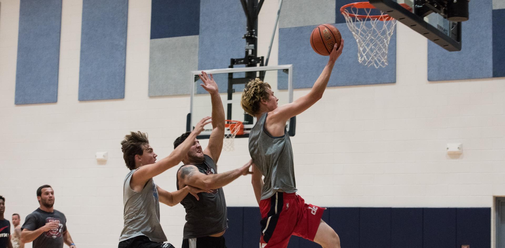 Men playing basketball